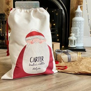 Personalisierter Weihnachtsmanns kleiner Helfer präsentieren Sack